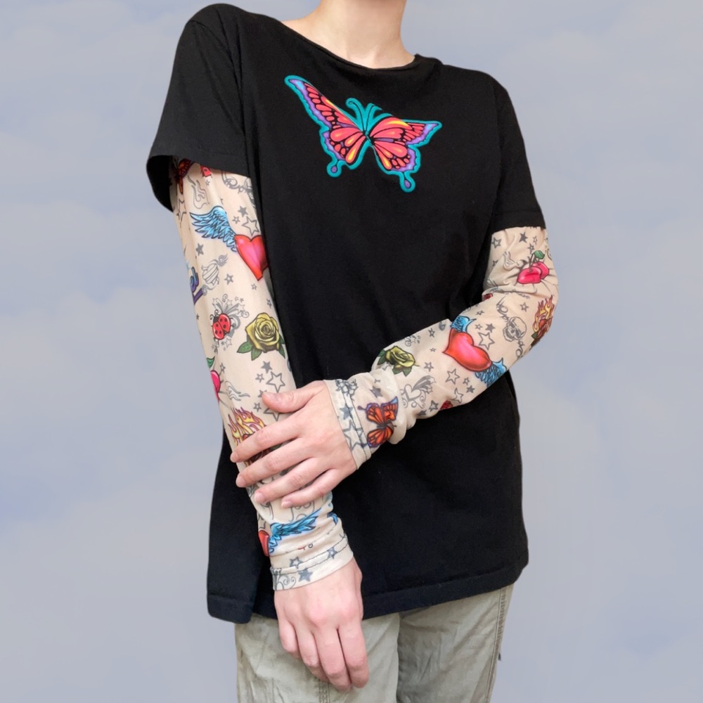 Delia’s faux tattoo mesh long sleeve